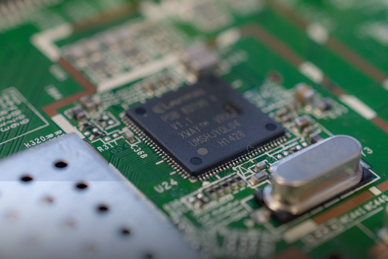 Close-up of PCB with microchip and electronic components