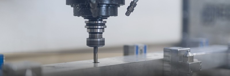 CNC precision milling machine manufacturing a component